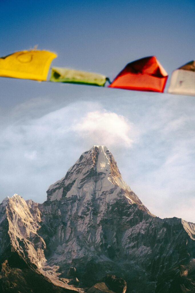 Captivating view of a Himalayan peak adorned with colorful prayer flags.
